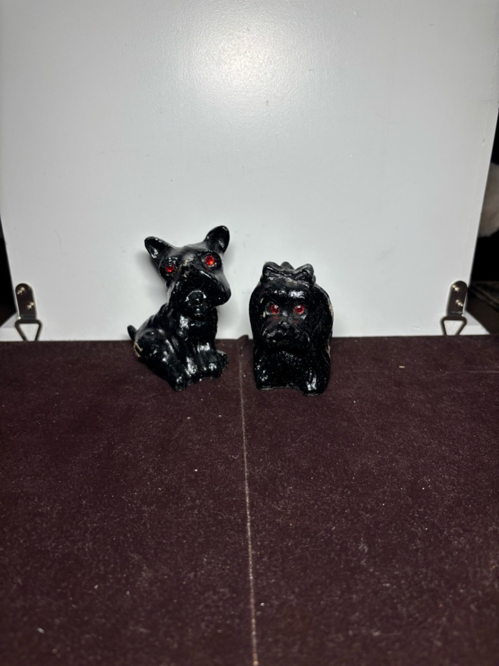Pair of Black Ceramic Dog Figurines with Red Eyes